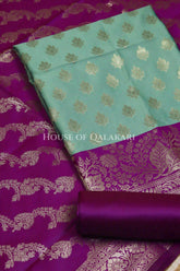 Banarasi Silk Unstitched Dress Material in Light Teal Green and Rich Purple contrast with Intricate Zari Buti – product