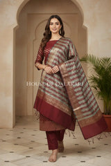 Banarasi Cotton Silk blend Unstitched Dress Material in Maroon Oak and with Bandhani-Leheriya inspired work – festive pose