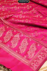 Banarasi Unstitched Dress Material in Rani Pink and with plain body and resham border and diagonally striped resham dupatta – dupatta