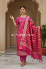 Banarasi Chanderi Cotton Unstitched Dress Material in Rani Pink and with matching horizontal zari stripe dupatta – festive pose