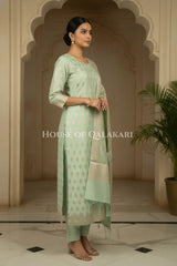 Banarasi Chanderi Cotton Unstitched Dress Material in Mint Green with intricate Zari Buti work – side pose