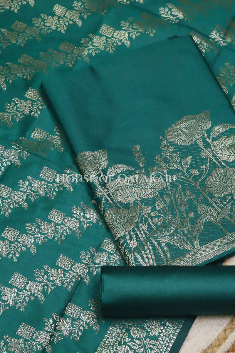 Banarasi silk Unstitched Dress Material in Emerald Green and with lotus floral border and diagonal striped zari work dupatta – product