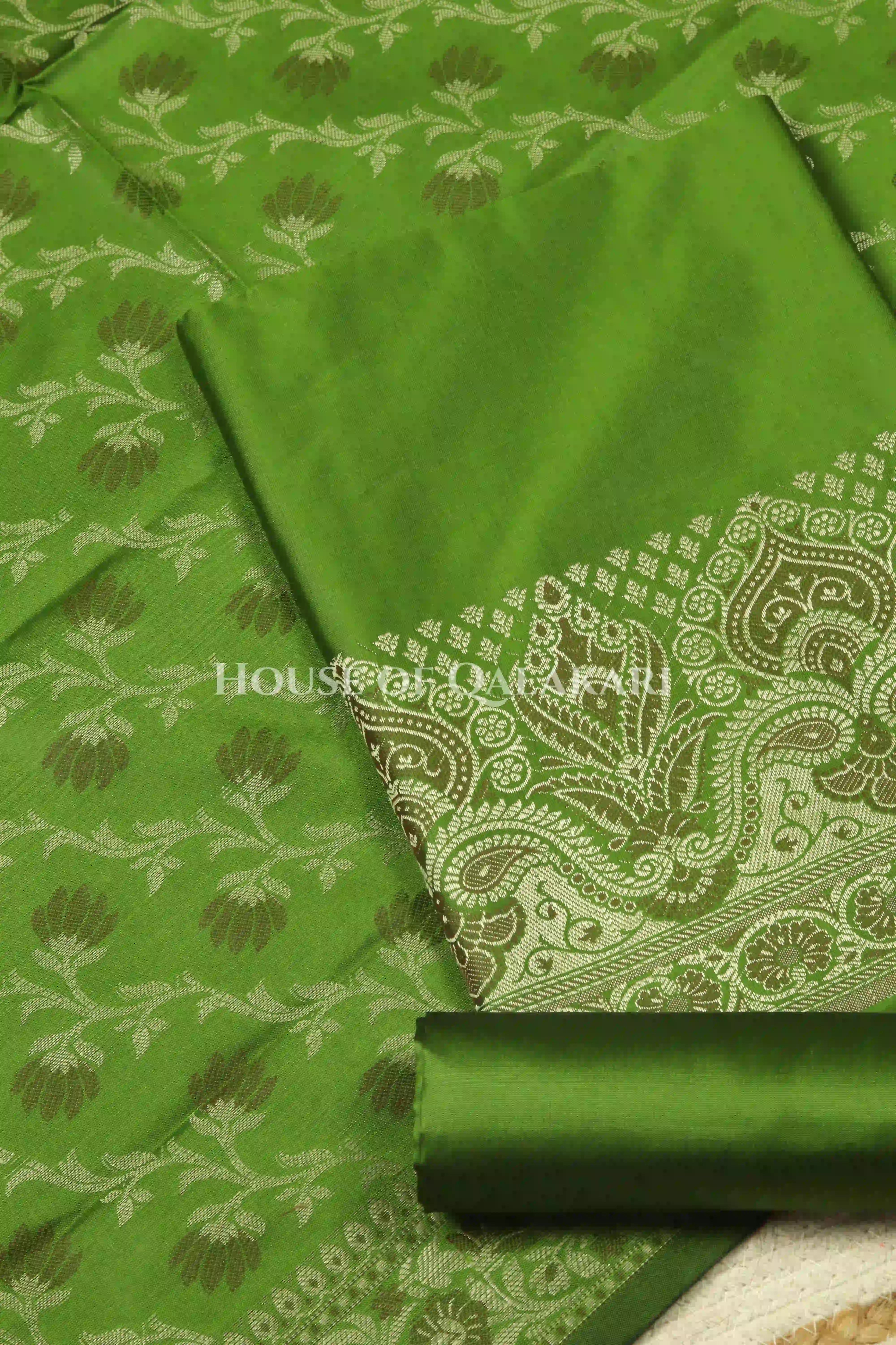 Banarasi Unstitched Dress Material in Light Olive Green and with plain body and resham border and diagonally striped resham dupatta – product