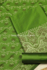 Banarasi Unstitched Dress Material in Light Olive Green and with plain body and resham border and diagonally striped resham dupatta – product
