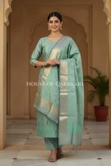Banarasi Chanderi Cotton Unstitched Dress Material in Sea Green and with matching floral vine jaal dupatta – festive pose