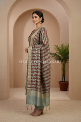 Banarasi Cotton Silk blend Unstitched Dress Material in maroon and Grey contrast with Intricate Zari Buti – side pose