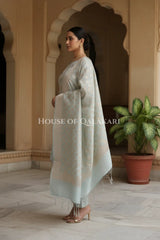 Banarasi Chanderi Cotton Unstitched Dress Material in Pale Silver and with matching floral vine jaal dupatta – side pose