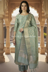Banarasi Cotton Silk blend Unstitched Dress Material in Antique Aqua green colour with Intricate Zari Diamond Buti – front pose