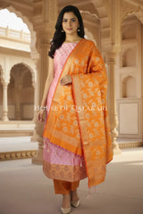 Banarasi Unstitched Dress Material in Dull Pink and with all over leaf buti and resham border along with floral resham jaal dupatta – front pose