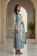 Banarasi Chanderi Cotton Unstitched Dress Material in Grey and with matching floral vine jaal dupatta – side pose
