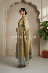 Banarasi Cotton Silk blend Unstitched Dress Material in mustard and silver grey contrast with Intricate Zari Buti – side pose