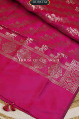 Banarasi silk Unstitched Dress Material in Rani Pink and with lotus floral border and diagonal striped zari work dupatta – dupatta