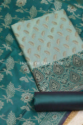 Banarasi Unstitched Dress Material in Silver Green and with all over leaf buti and resham border along with floral resham jaal dupatta – product