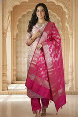 Banarasi Silk Unstitched Dress Material in Light Purple and rani pink contrast with Intricate Zari Buti – festive pose