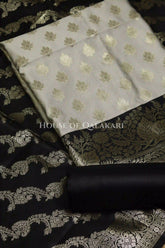 Banarasi Silk Unstitched Dress Material in light grey and black contrast with Intricate Zari Buti – product