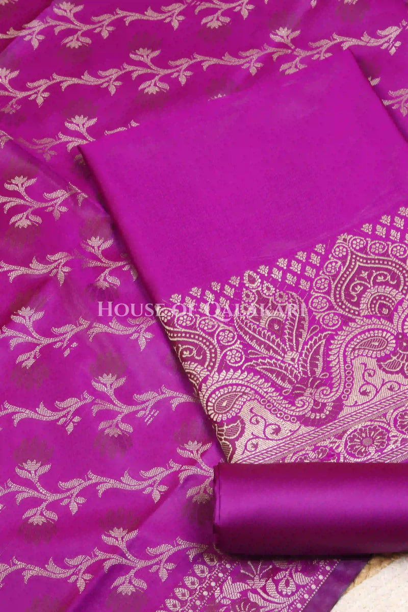 Banarasi Unstitched Dress Material in Rich Purple and with plain body and resham border and diagonally striped resham dupatta – product