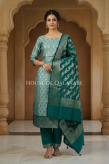 Banarasi Silk Unstitched Dress Material in Blue Grey and Deep Bluish Green contrast with Intricate Zari Buti – front pose