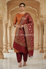 Banarasi silk Unstitched Dress Material in Clay Brown and Maroon Oak contrast with Intricate Zari Buti – front pose