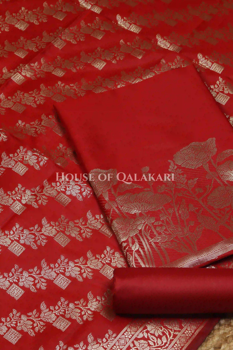 Banarasi silk Unstitched Dress Material in Red and with lotus floral border and diagonal striped zari work dupatta – product