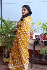 Mustard Bagru Mulmul cotton Saree with Off-White Prints