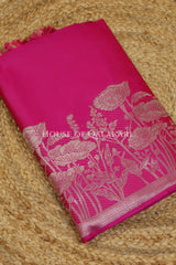 Banarasi silk Unstitched Dress Material in Rani Pink and with lotus floral border and diagonal striped zari work dupatta – kurta