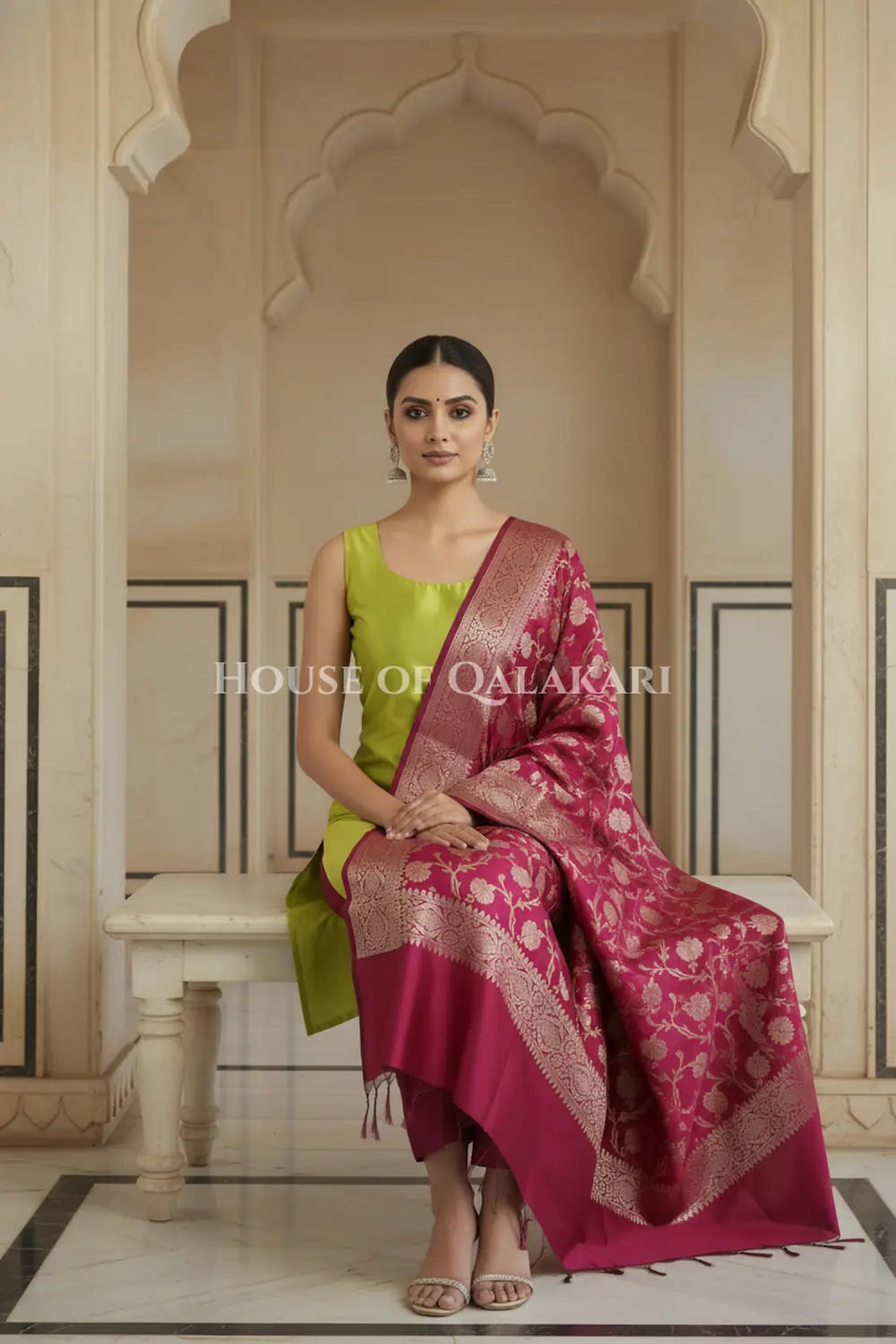 Banarasi silk Unstitched Dress Material in Olive Green and Wine Red contrast with Intricate Zari Buti – sitting pose