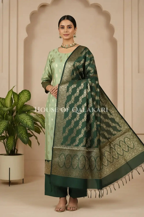 Banarasi Silk in pistachio green and bottle green contrast with Intricate Zari Buti – front pose