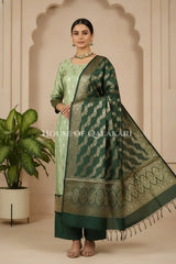 Banarasi Silk in pistachio green and bottle green contrast with Intricate Zari Buti – front pose
