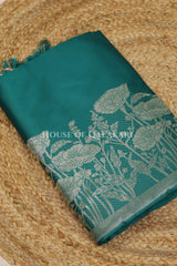 Banarasi silk Unstitched Dress Material in Emerald Green and with lotus floral border and diagonal striped zari work dupatta – kurta
