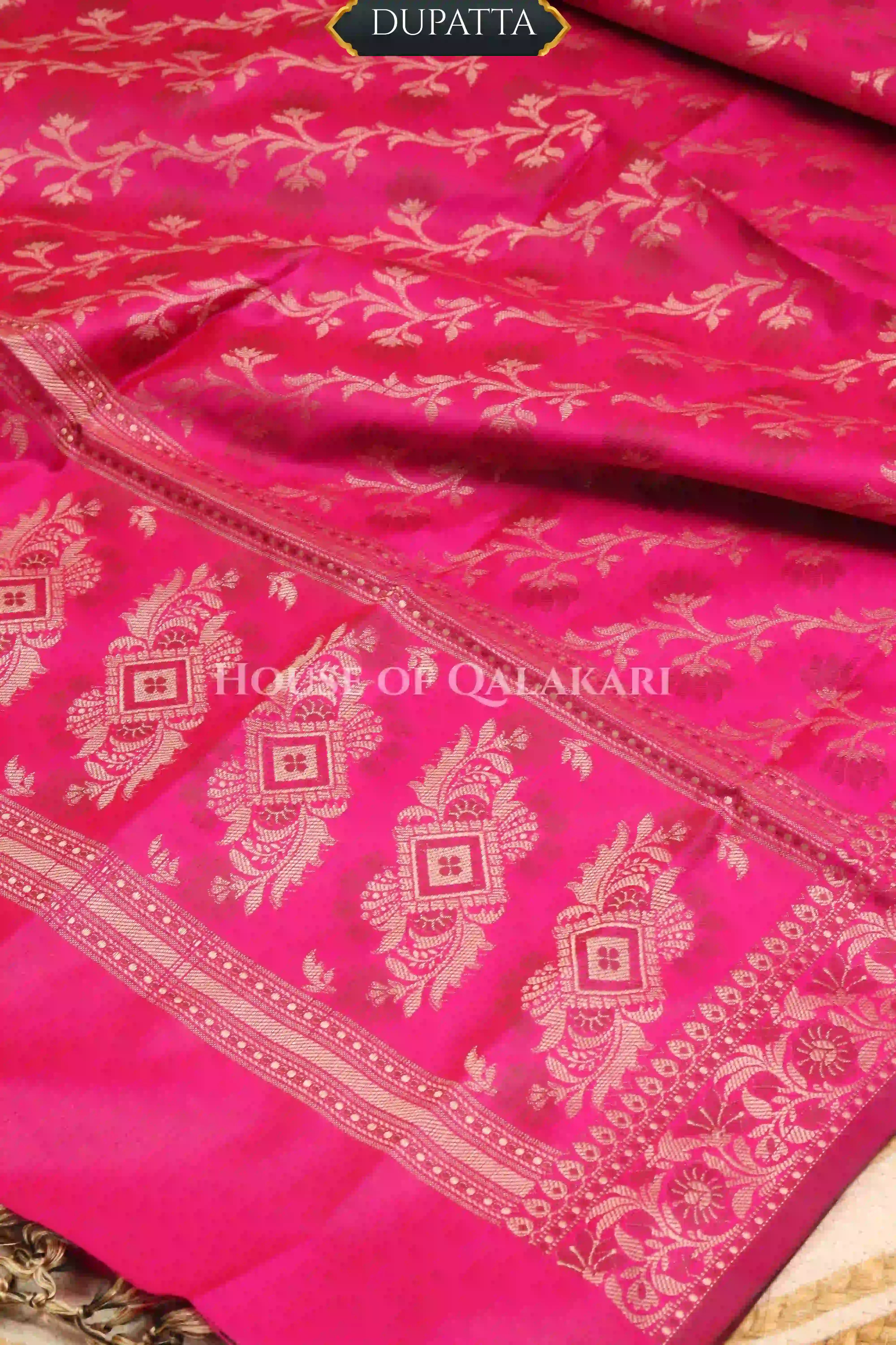 Banarasi Unstitched Dress Material in Rani Pink and with plain body and resham border and diagonally striped resham dupatta – dupatta