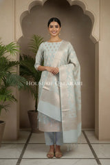 Banarasi Chanderi Cotton Unstitched Dress Material in Ash Grey with intricate Zari Buti work – festive pose