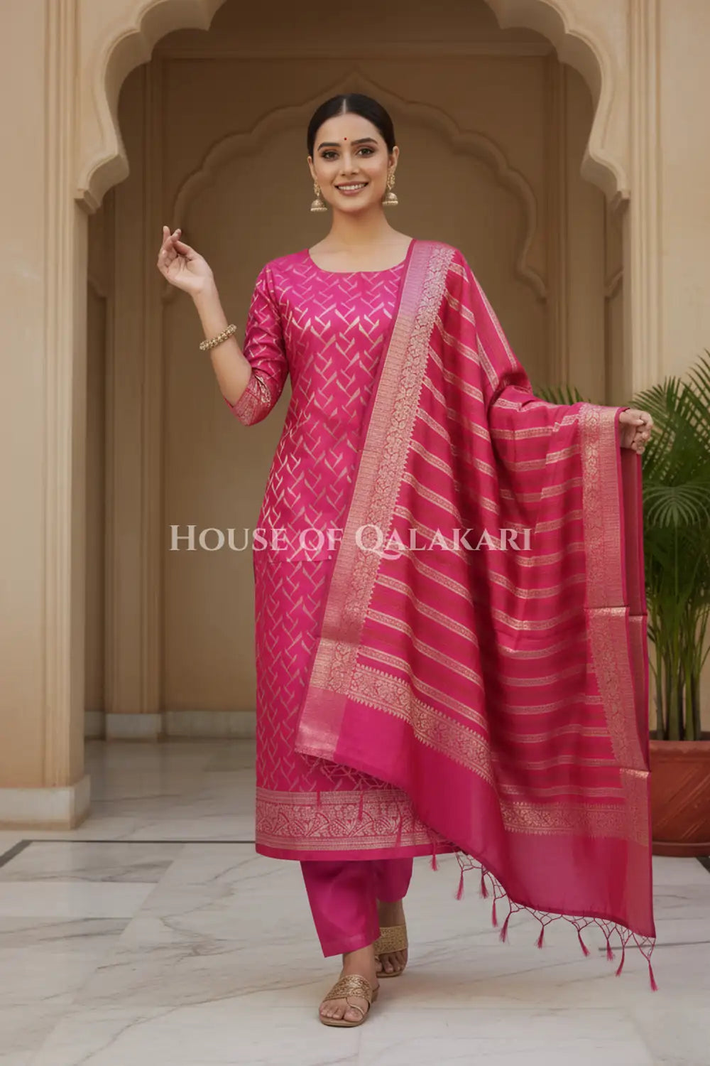 Banarasi Chanderi Cotton Unstitched Dress Material in Rani Pink and with matching horizontal zari stripe dupatta – festive pose