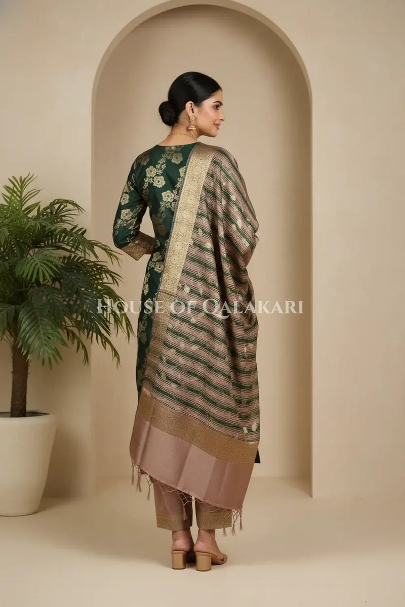 Banarasi Cotton Silk blend Unstitched Dress Material in deep emerald green and rose gold contrast with Intricate Zari Buti – back pose