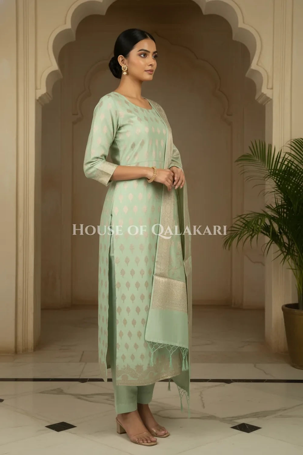 Banarasi Chanderi Cotton Unstitched Dress Material in Mint Green with intricate Zari Buti work – side pose