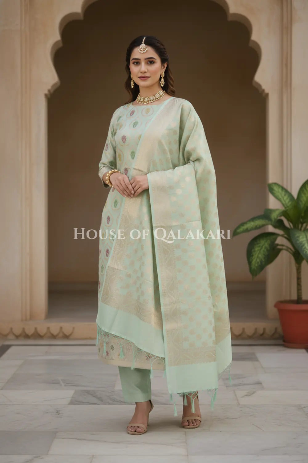Banarasi Chanderi Cotton Unstitched Dress Material in Light Sea Green and with matching floral vine jaal dupatta – wedding pose