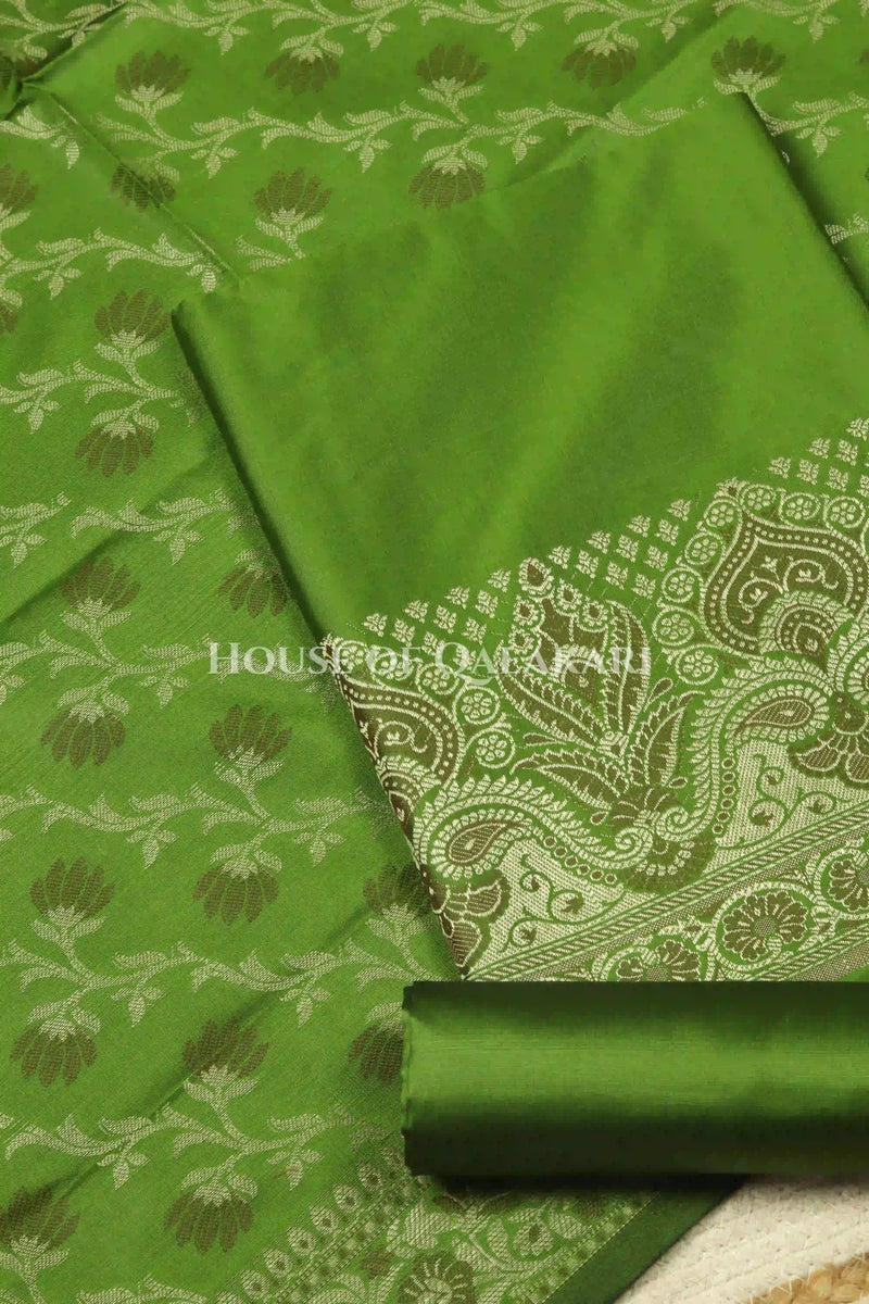 Banarasi Unstitched Dress Material in Light Olive Green and with plain body and resham border and diagonally striped resham dupatta – product