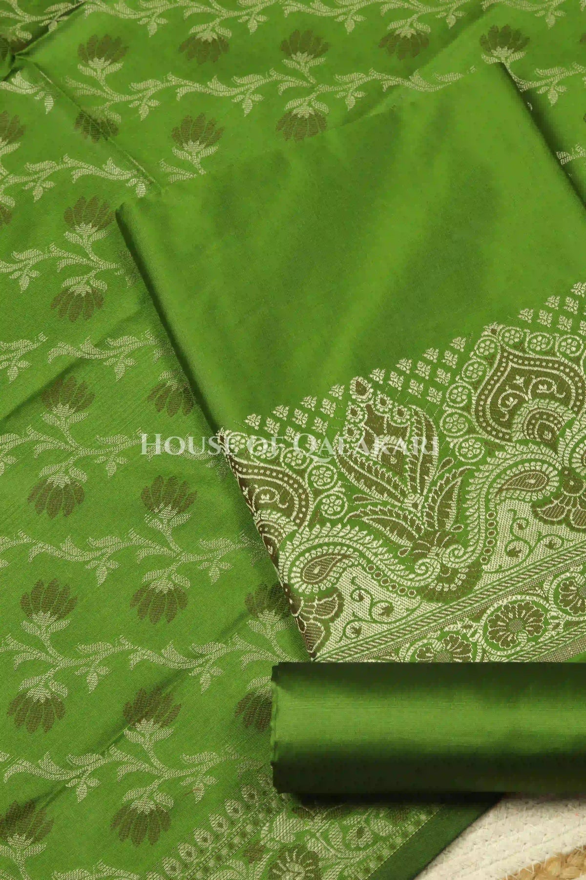 Banarasi Unstitched Dress Material in Light Olive Green and with plain body and resham border and diagonally striped resham dupatta – product