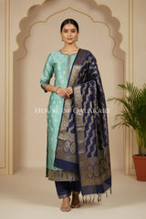 Banarasi Silk in sky blue and navy blue contrast with Intricate Zari Buti – front pose