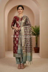 Banarasi Cotton Silk blend Unstitched Dress Material in maroon and Grey contrast with Intricate Zari Buti – front pose