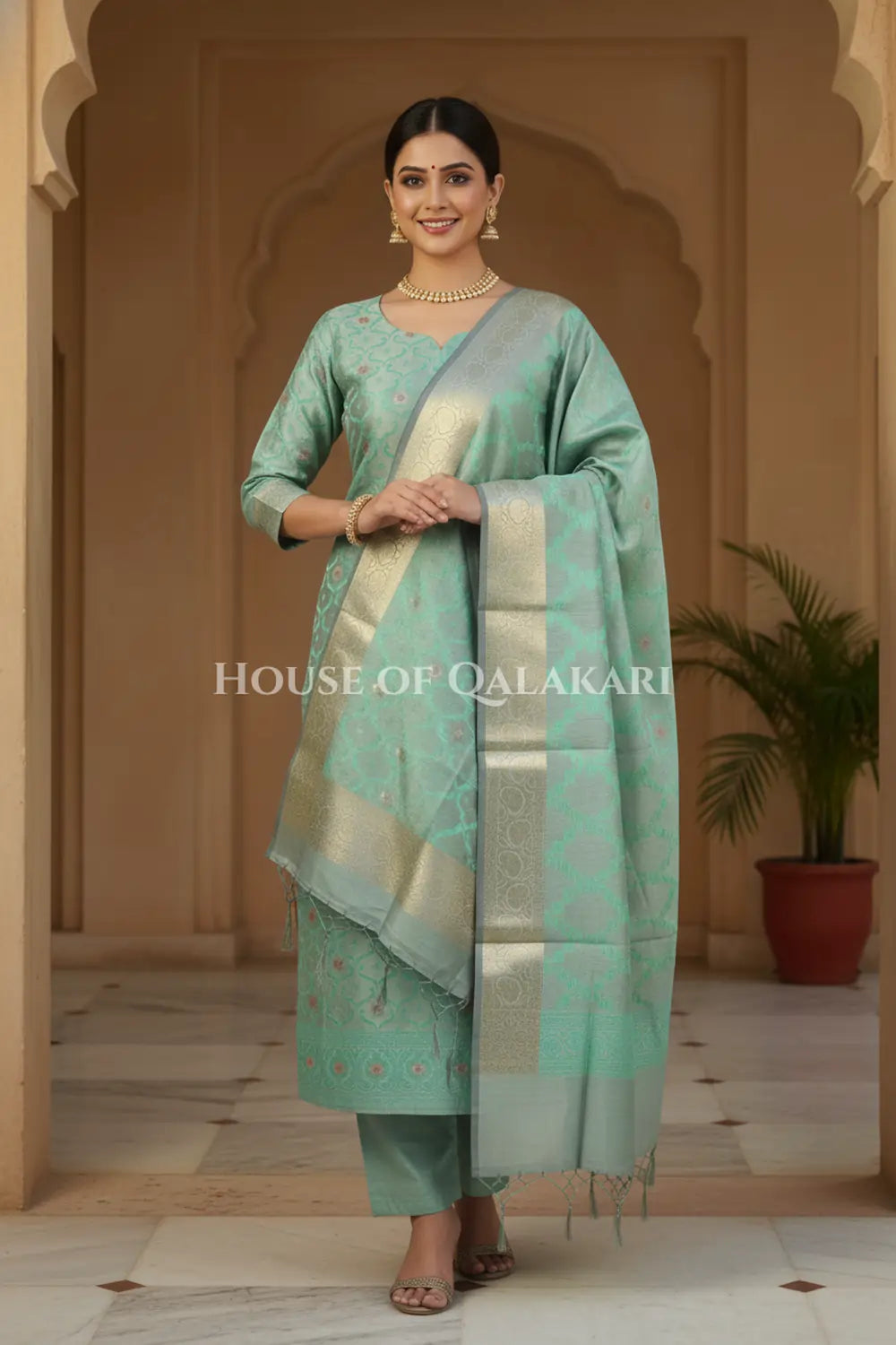 Banarasi Chanderi Cotton Unstitched Dress Material in Sea Green and with matching floral vine jaal dupatta – festive pose