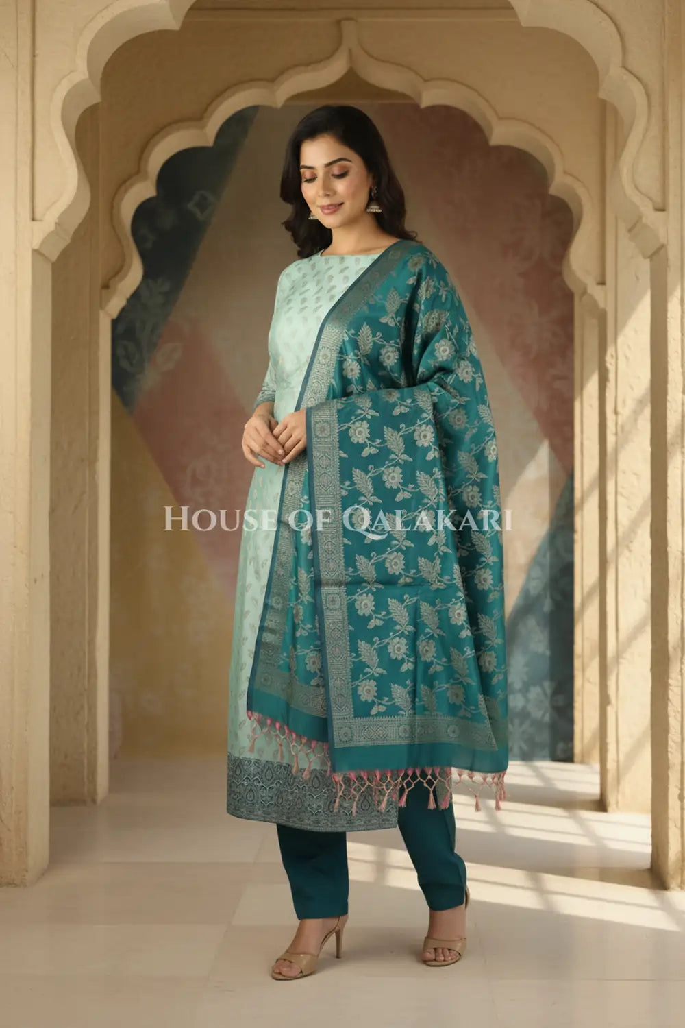 Banarasi Unstitched Dress Material in Silver Green and with all over leaf buti and resham border along with floral resham jaal dupatta – wedding pose