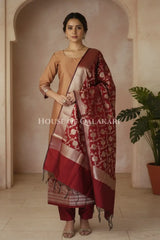 Banarasi silk Unstitched Dress Material in mustard and red contrast with Intricate Zari Buti – front pose