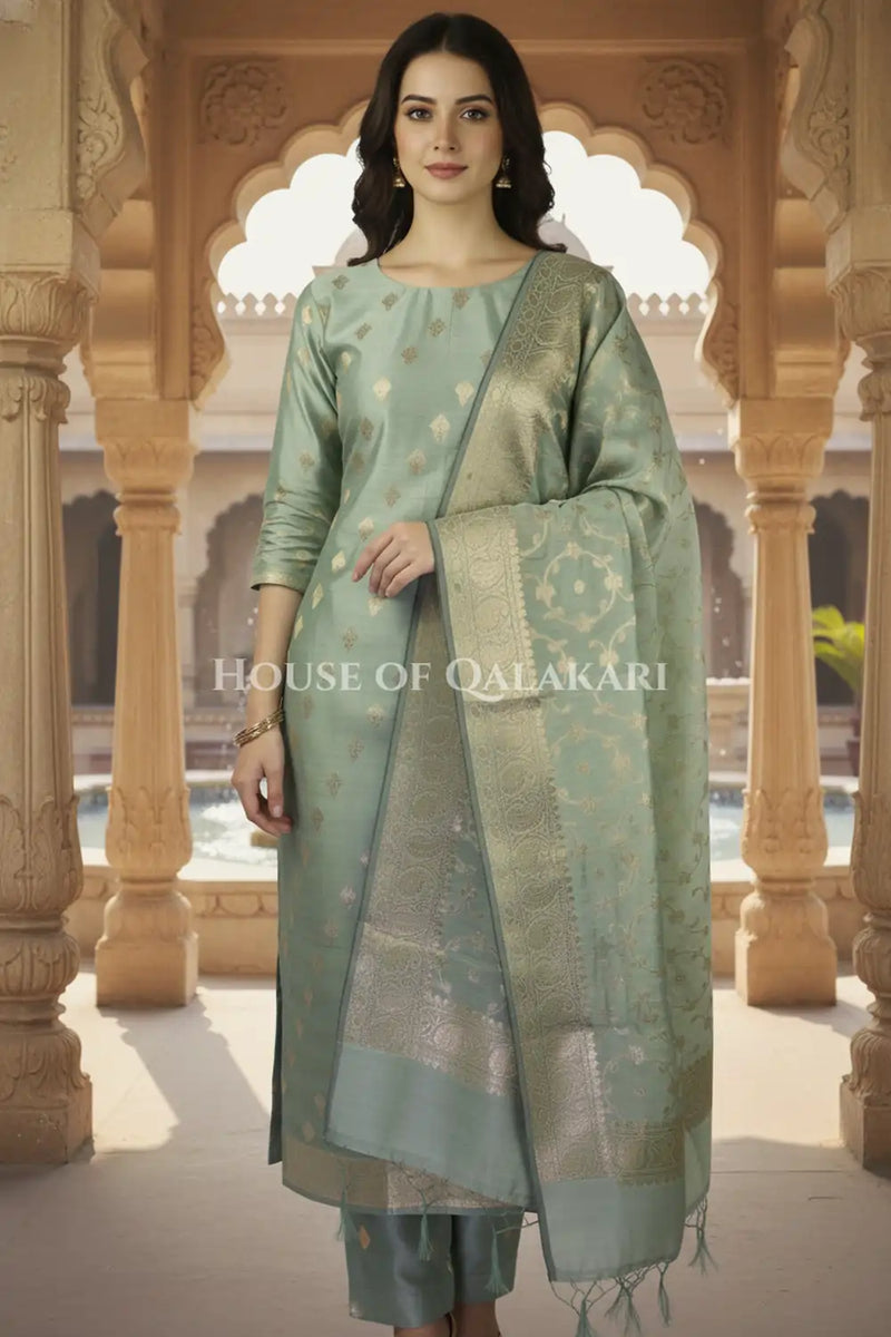 Banarasi Cotton Silk blend Unstitched Dress Material in Antique Aqua green colour with Intricate Zari Diamond Buti – front pose