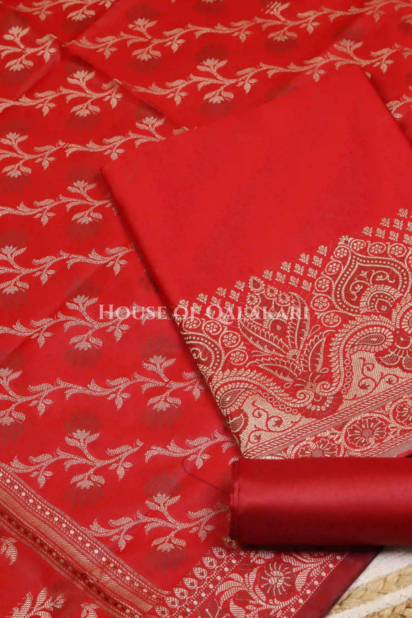 Banarasi Unstitched Dress Material in Red and with plain body and resham border and diagonally striped resham dupatta – product