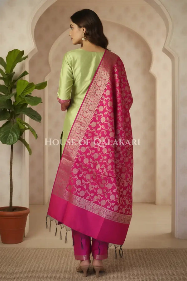 Banarasi silk Unstitched Dress Material in parrot green and pink contrast with Intricate Zari Buti – back pose