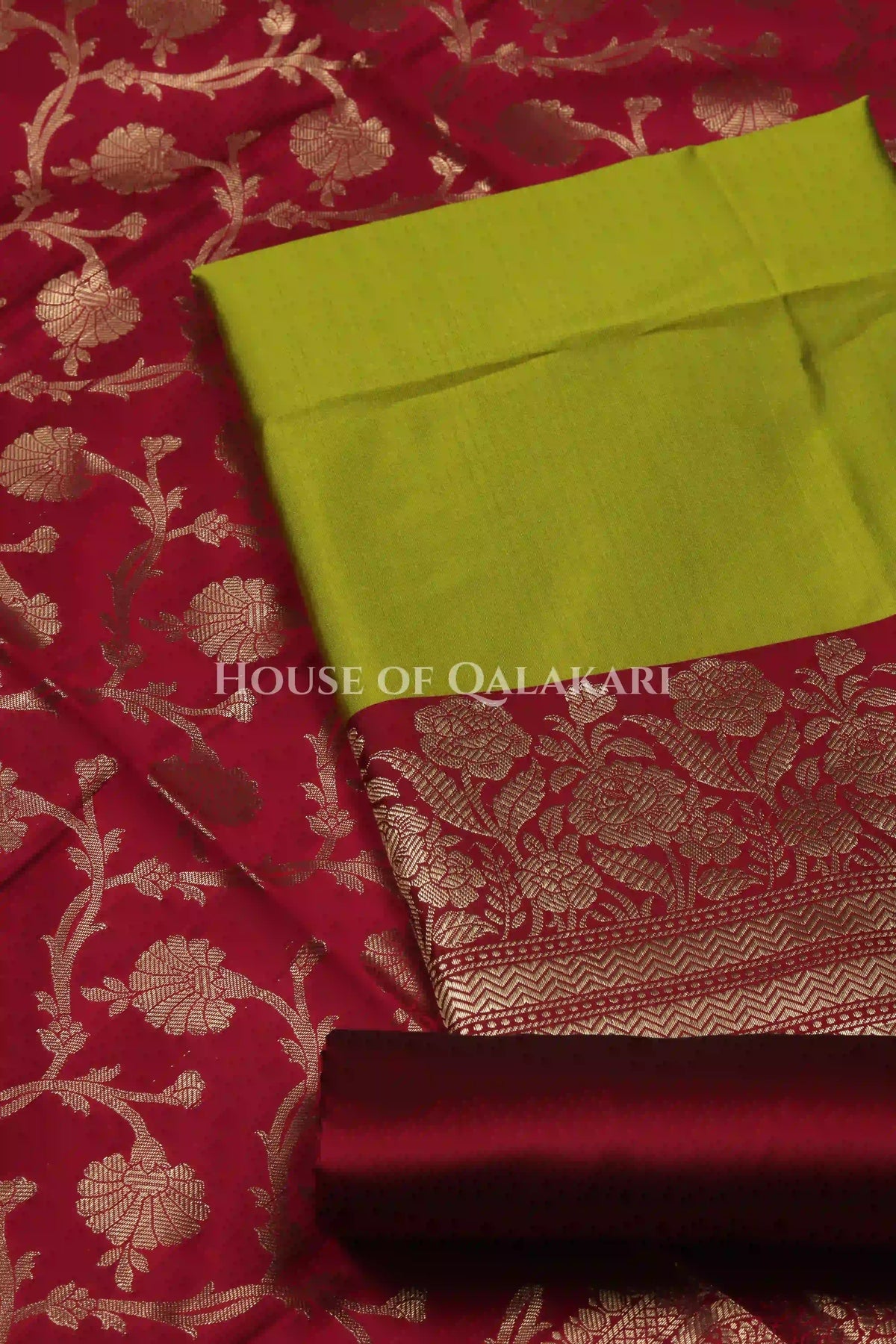 Banarasi silk Unstitched Dress Material in Olive Green and Wine Red contrast with Intricate Zari Buti – product
