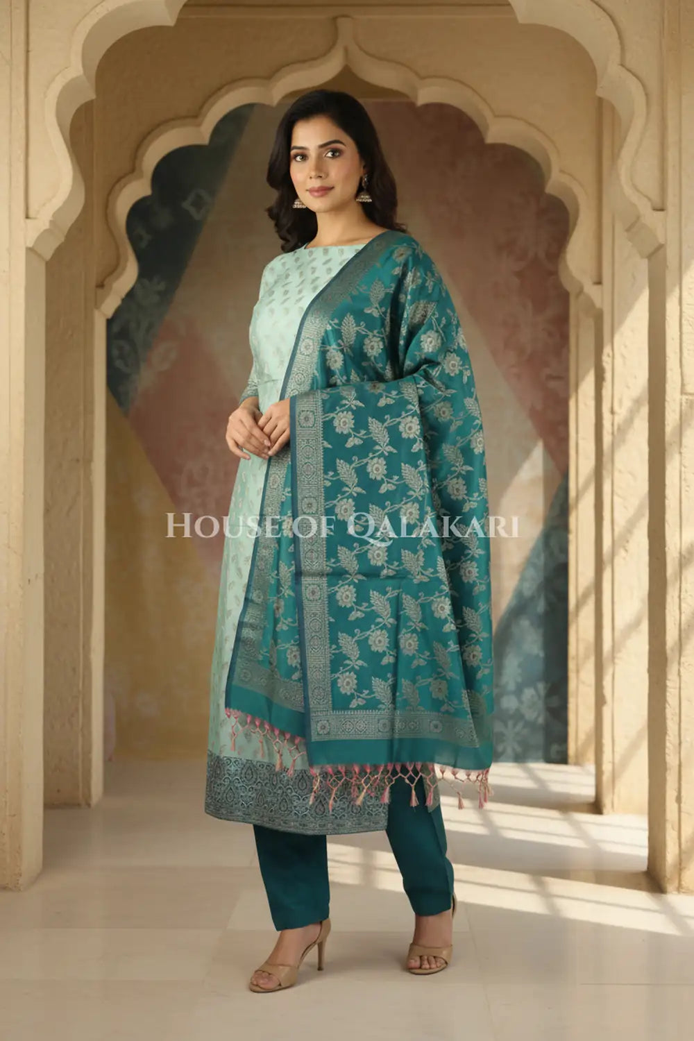 Banarasi Unstitched Dress Material in Silver Green and with all over leaf buti and resham border along with floral resham jaal dupatta – front pose