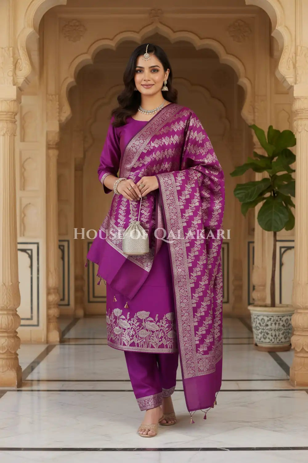 Banarasi silk Unstitched Dress Material in Rich Purple and with lotus floral border and diagonal striped zari work dupatta – wedding pose