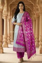 Banarasi Unstitched Dress Material in Light Blue and with all over leaf buti and resham border along with floral resham jaal dupatta – front pose