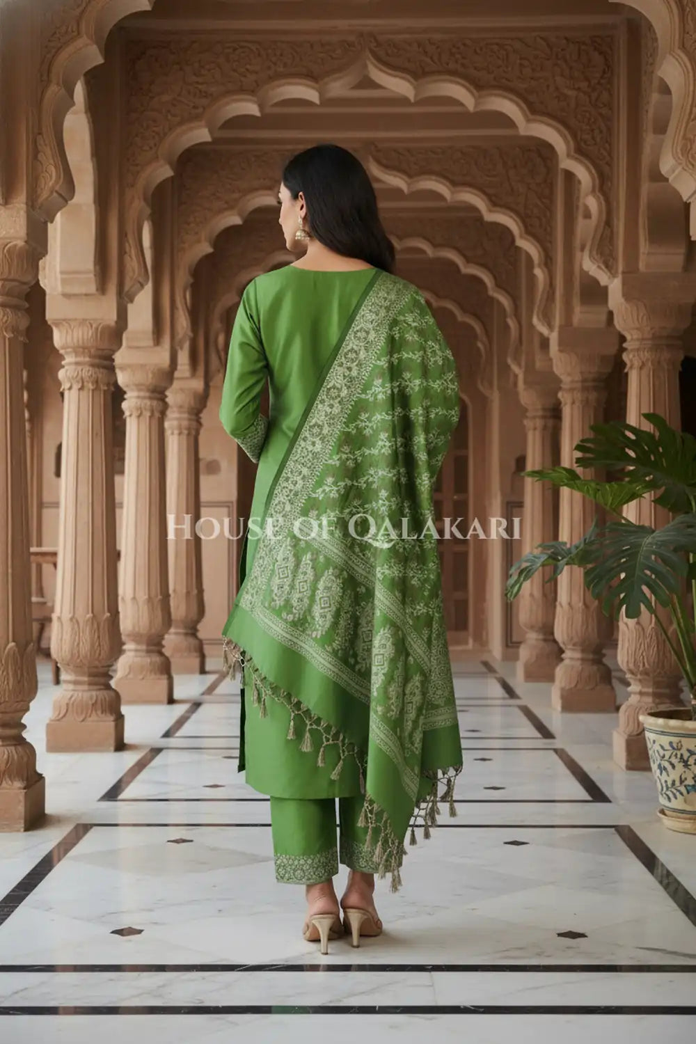 Banarasi Unstitched Dress Material in Light Olive Green and with plain body and resham border and diagonally striped resham dupatta – back pose